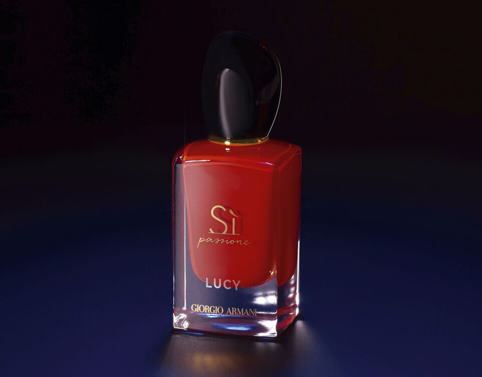 A elegant red perfume bottle with a sleek design, featuring the label "Si Passione" and "Lucy" by Giorgio Armani, set against a gradient dark background.