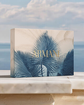Summer gift set box displayed on a terrace with a sea view.