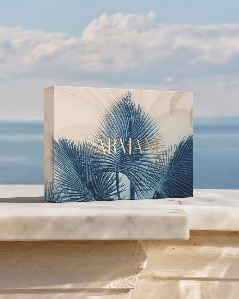 Summer gift set box displayed on a terrace with a sea view.
